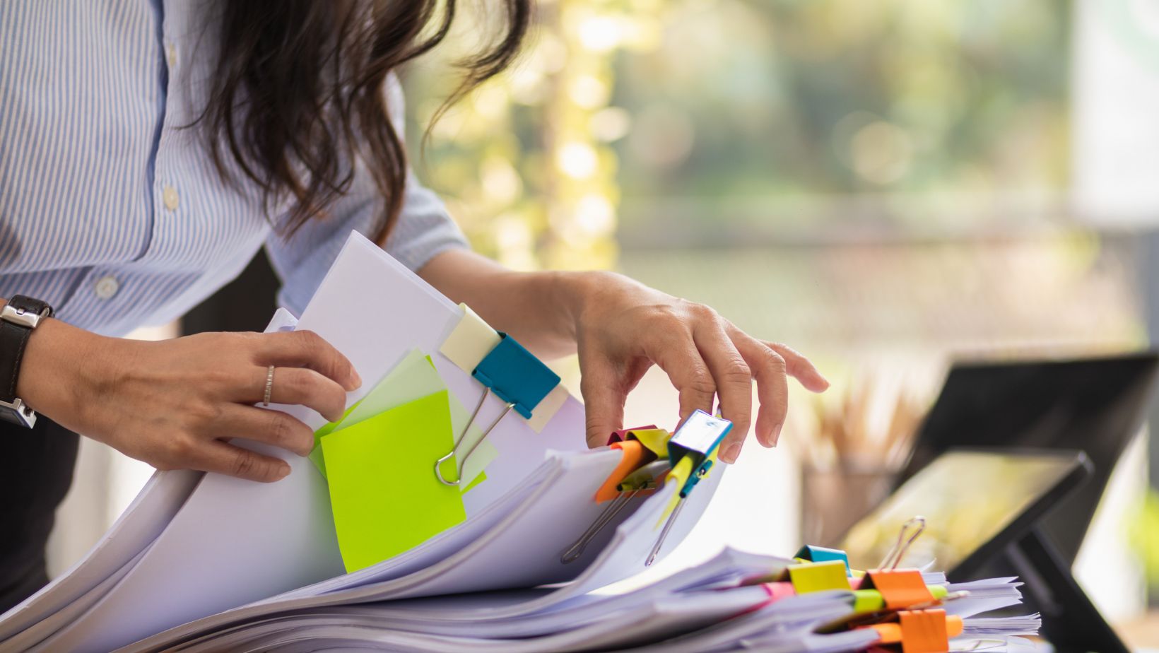 Person going through a bunch of documents