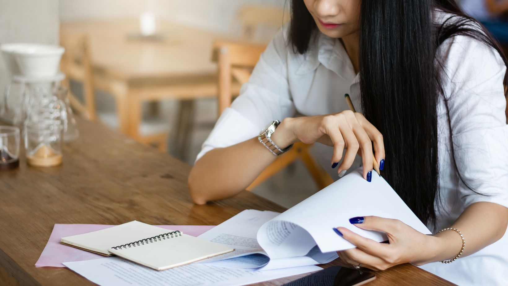 a woman looking through documents